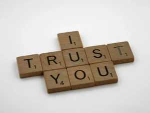 Scrabble tiles spell out "I trust you"