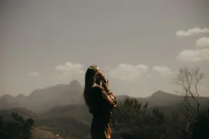 A woman looks up to the sky
