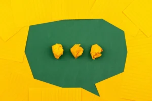 a chat bubble illustrated from cut out paper