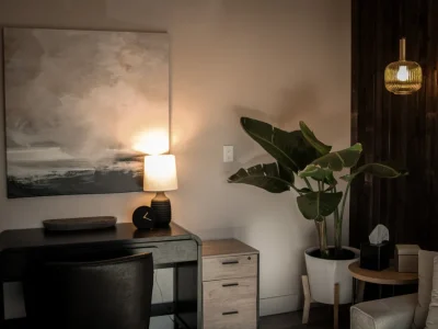 a desk and houseplant in a therapy clinic